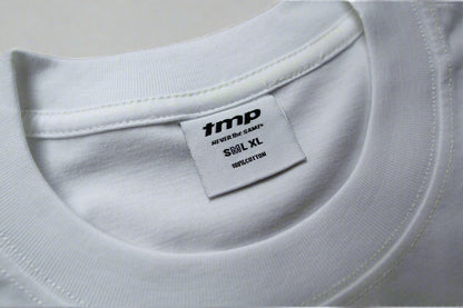 White t-shirt with a brand label on a grey background